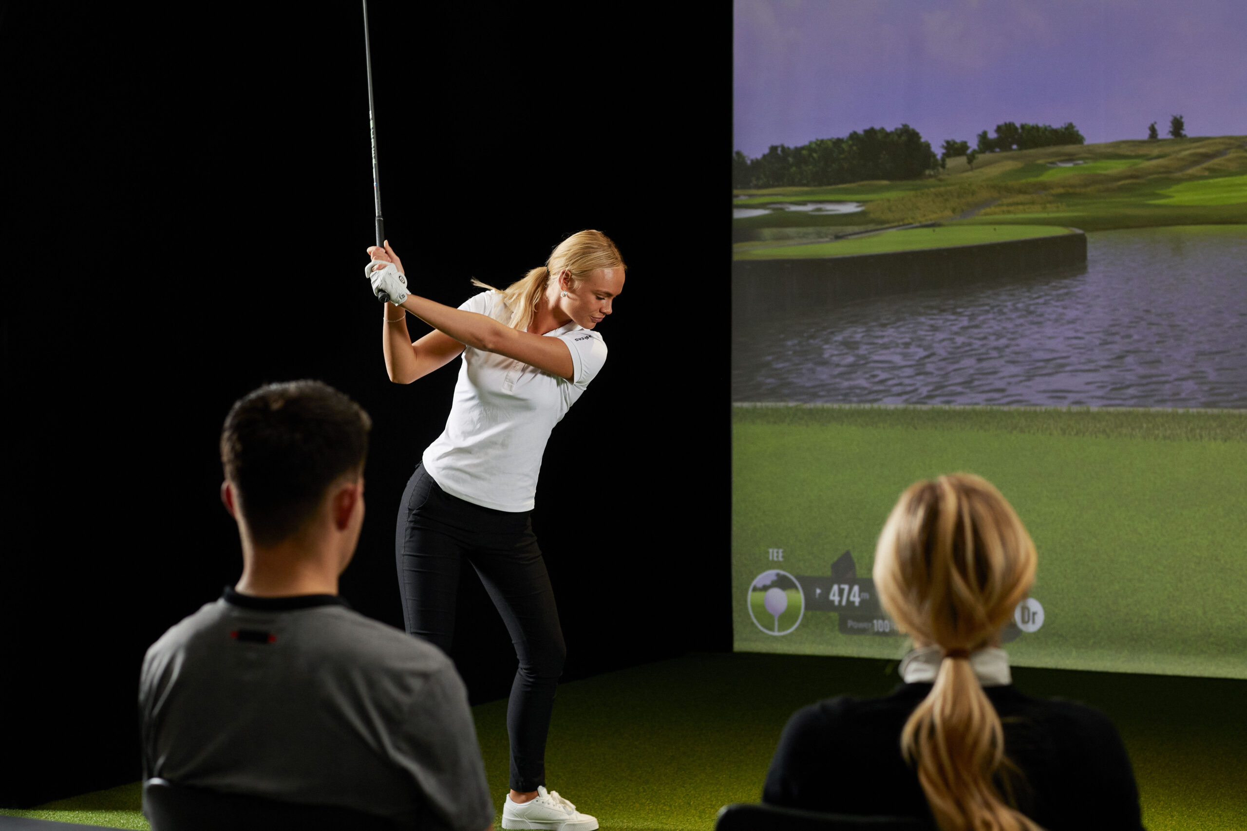 Friends using a Trackman Golf Simulator
